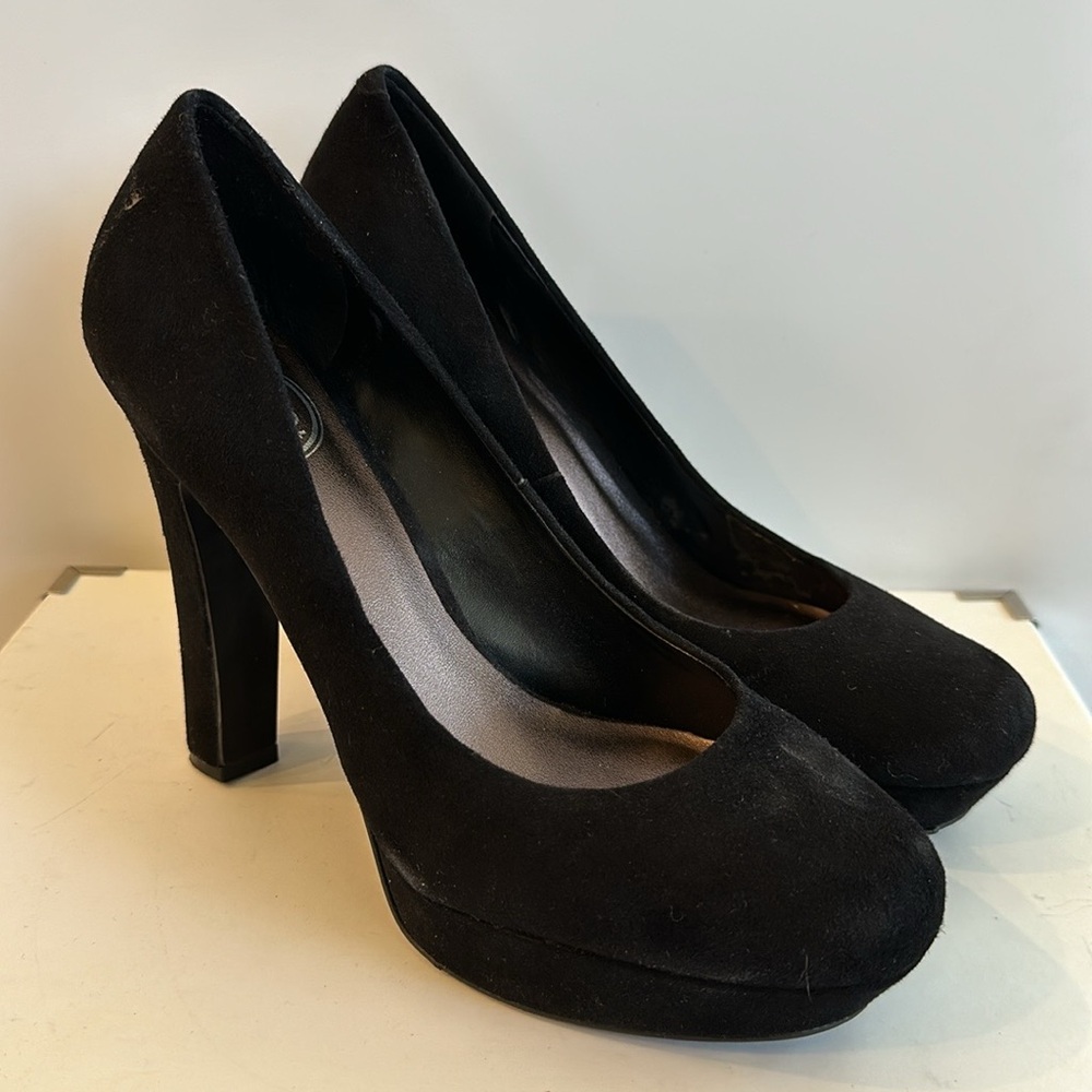 Black suede sky high pumps.